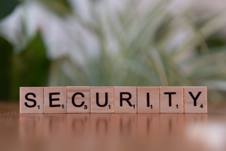 referral fraud prevention - Close-up of wooden Scrabble tiles spelling SECURITY, symbolizing cybersecurity and protection.