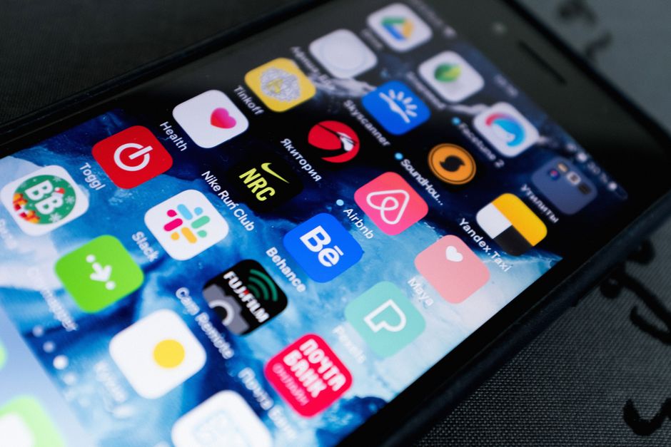 small business marketing - Detailed view of smartphone displaying multiple app icons on screen, highlighting technology use.